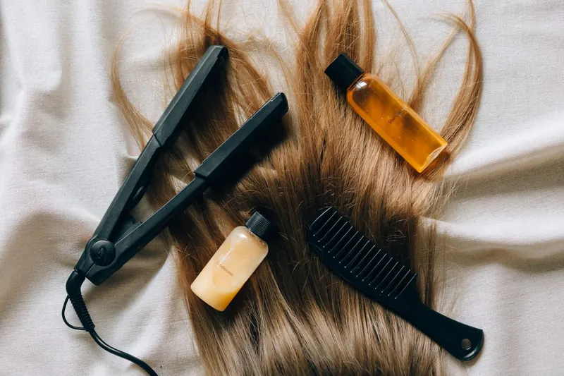 Aesthetic flat lay of hair products and tools for styling and grooming